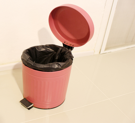 Opened trash bin in resort roomの写真素材
