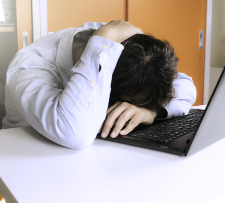 businessman holds his hands on his head to rest for hardwork
の写真素材