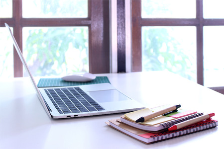 side view,office table desk. workspace with notebook and mouse on copy space