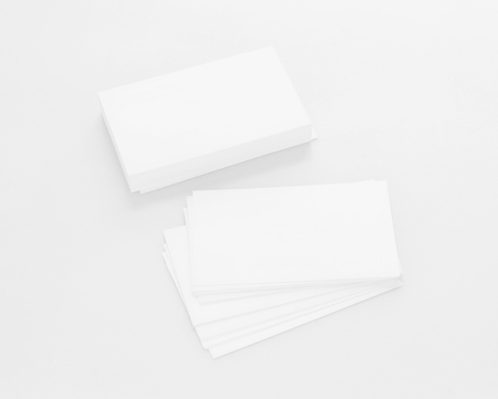 Mockup of business cards on white textured paper backgroundの写真素材
