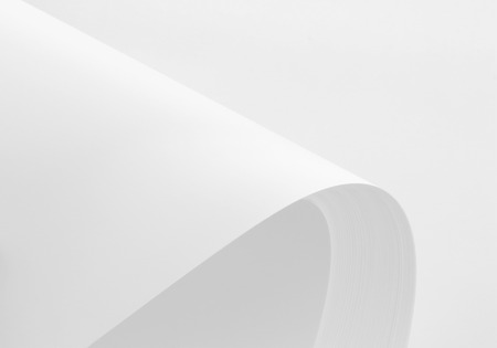 A4 blank paper stack with soft shadows isolated on white backgroundの写真素材