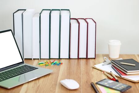 Workspace with office equipments on wood desk work background