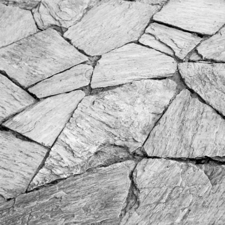 black and white background texture of stone wallの写真素材