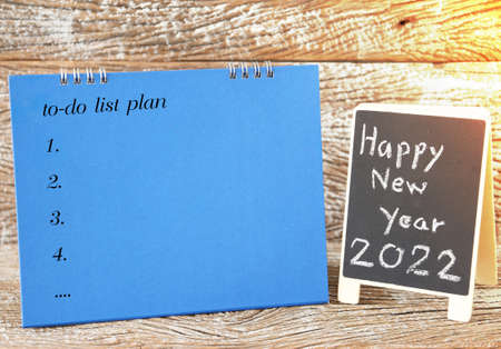 happy new year 2022 black board sign and calendar plan list to do for backgroundの写真素材