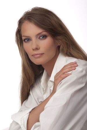 Portrait close up of the young woman of the European type with blue eyes, on a white backgroundの写真素材