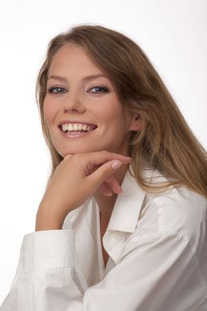 Portrait of the young European happy woman with blue eyes, on a white backgroundの写真素材