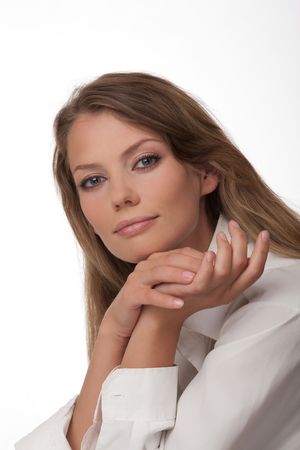 Portrait close up of the young woman of the European type with blue eyes, on a white backgroundの写真素材