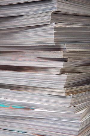 Close-up of a pile of old thick magazines.の写真素材