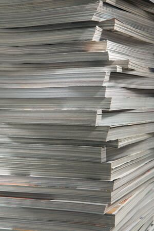 The big pile of thick glossy magazinesの写真素材