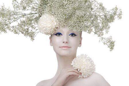 Model in an image of the winter, created by means of a make-up, Body-Art and floristics art on a white background.の写真素材