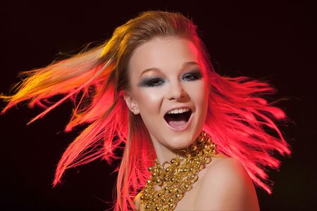 Portrait close up of the young girl having fun on a celebratory party.の写真素材