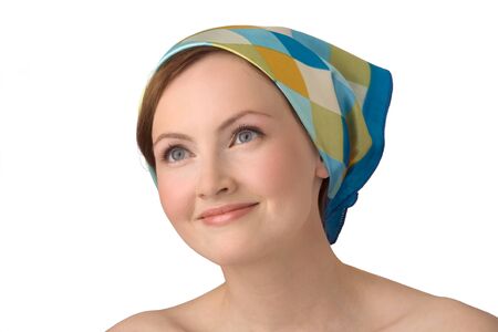 Portrait of young beautiful girl with naked shoulders, with kerchief on head.の写真素材