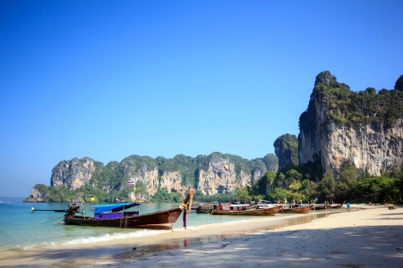Longtail boat and blue sky at Railay Beach Thailandの写真素材