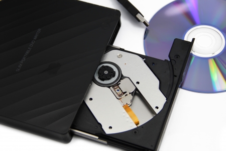 open tray of dvd writer with a dvdの写真素材