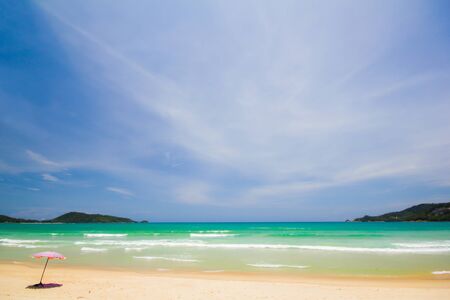 one  umbrella on white sand beachの写真素材