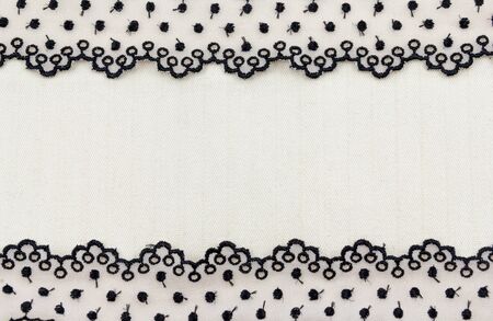 Lace flowers frame close up isolated on Fabric textureの写真素材