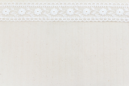 Lace flowers frame close up isolated on Fabric textureの写真素材