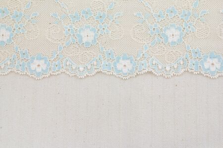 Lace flowers frame close up isolated on Fabric texture