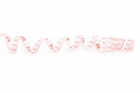 white tape measuring on white backgroundの写真素材
