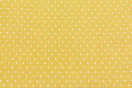 Yellow and White Tiny Distressed Polka Dots Backgroundの写真素材