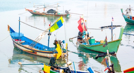 Local fishing boats parked beside the harbor at Koh Samui.の写真素材