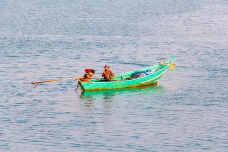 Fisher man in the Green  long-tail Boatのeditorial素材
