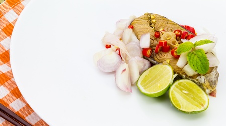Salted fish Spicy salted with lamon,Pepper and Onionsの写真素材