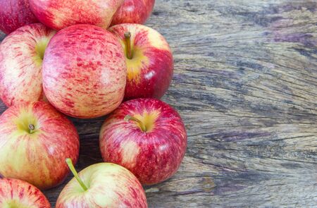 Red apples in wooden background with Copyspaceの写真素材