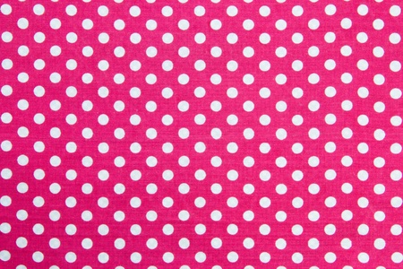 Pink Fabric and White Tiny Polka Dots Backgroundの写真素材