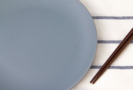Empty gray dish and Chopsticksの写真素材