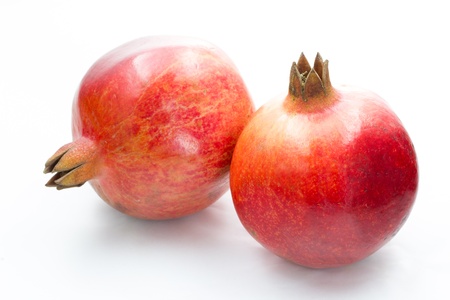 Ripe pomegranate fruit isolated on white backgroundの写真素材