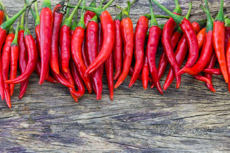 Red Hot Chili Peppers over wooden background