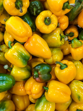 Yellow Bell peppers in Vegetables Marketの写真素材
