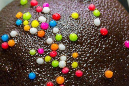 close-up of Chocolate balls with colourful toppingの写真素材