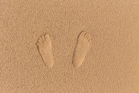 Footprint in the sand beachの写真素材