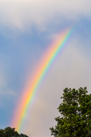 Beautiful rainbow after bad weather and rainの写真素材
