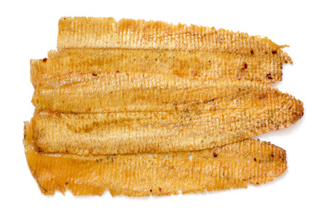 Sweet and spicy dried squid isolate on whiteの写真素材