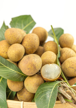 Fresh longan in basket  isolated on white background.の写真素材