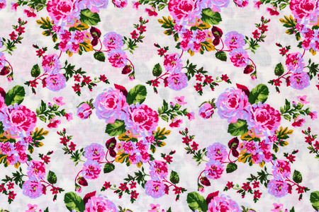 Fragment of colorful retro tapestry textile pattern with floral ornament useful as backgroundの写真素材