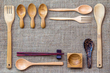 wooden utensils on a sackcloth backgroundの写真素材