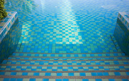 part of swimming pool with blue waterの写真素材