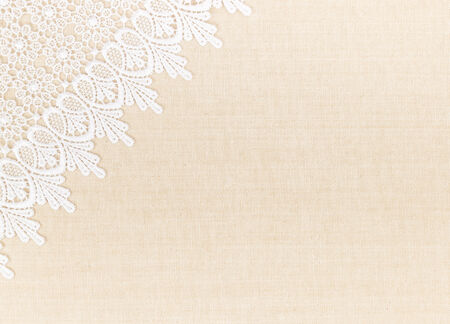 Close up of Lace flowers frame over Fabric design for border or backgroundの写真素材