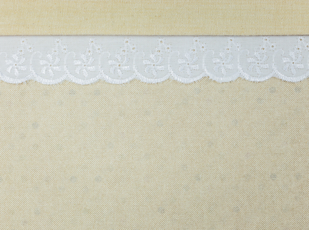 White Ornamental Lace border over fabric design for border or backgroundの写真素材