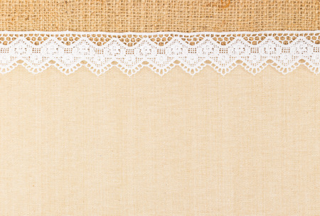White Ornamental Lace over canvas and Burlap design for border or backgroundの写真素材