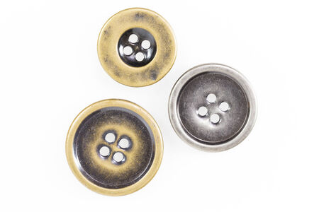 Metal sewing buttons collection isolate on white backgroundの写真素材
