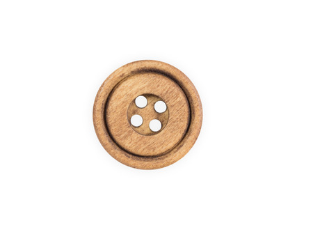 Wooden sewing button isolate on white backgroundの写真素材