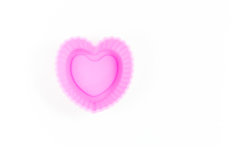 Pink silicone baking cup isolate on whiteの写真素材