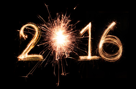 2016 word written with Sparkle firework on black background
