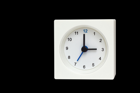 White Square clock isolated on Black background. Time three o'clock
