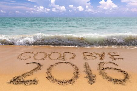 New Years 2017 is coming concept, Goodbye 2016 on the sand beachの写真素材